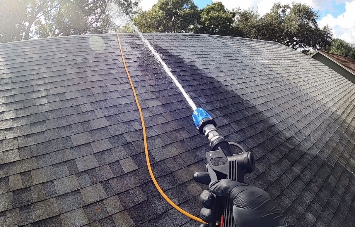 Professional roof soft washing service in action