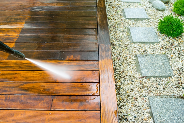 Professional deck cleaning showing before and after results