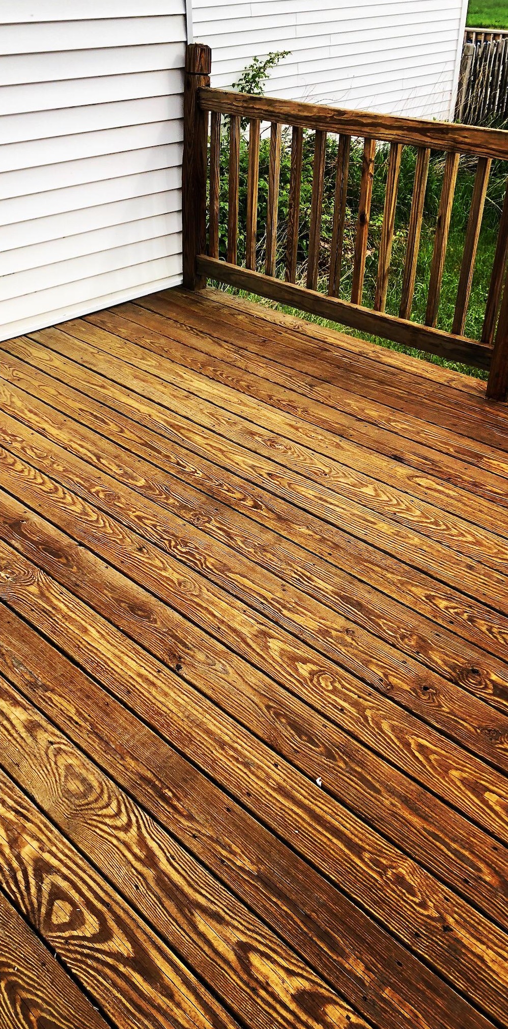 After: Weathered deck before and after restoration