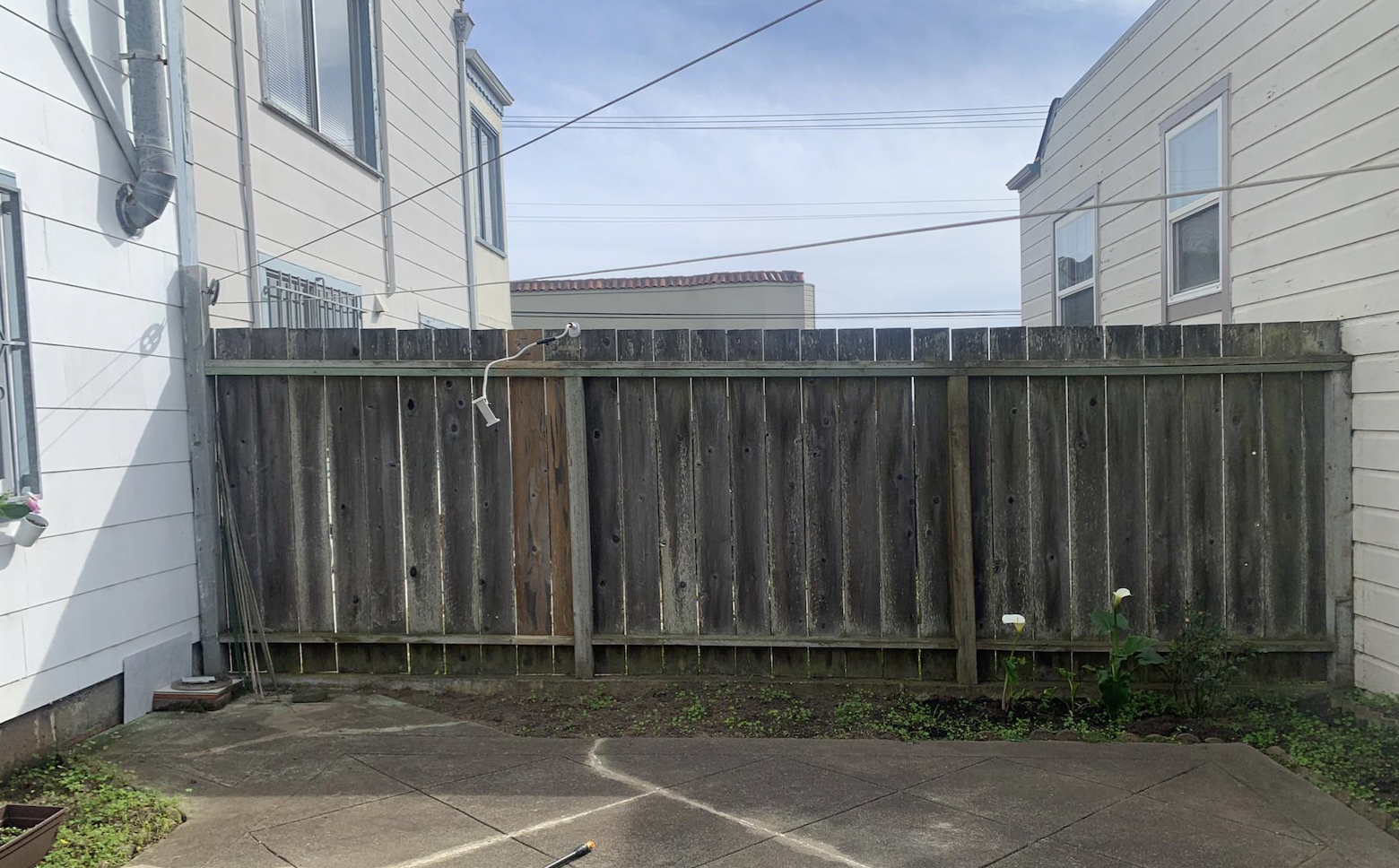 Before: Dirty fence before and after cleaning