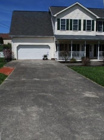 Before: Suburban home driveway before and after pressure washing