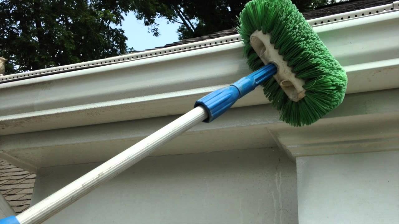 Professional gutter cleaning equipment in action