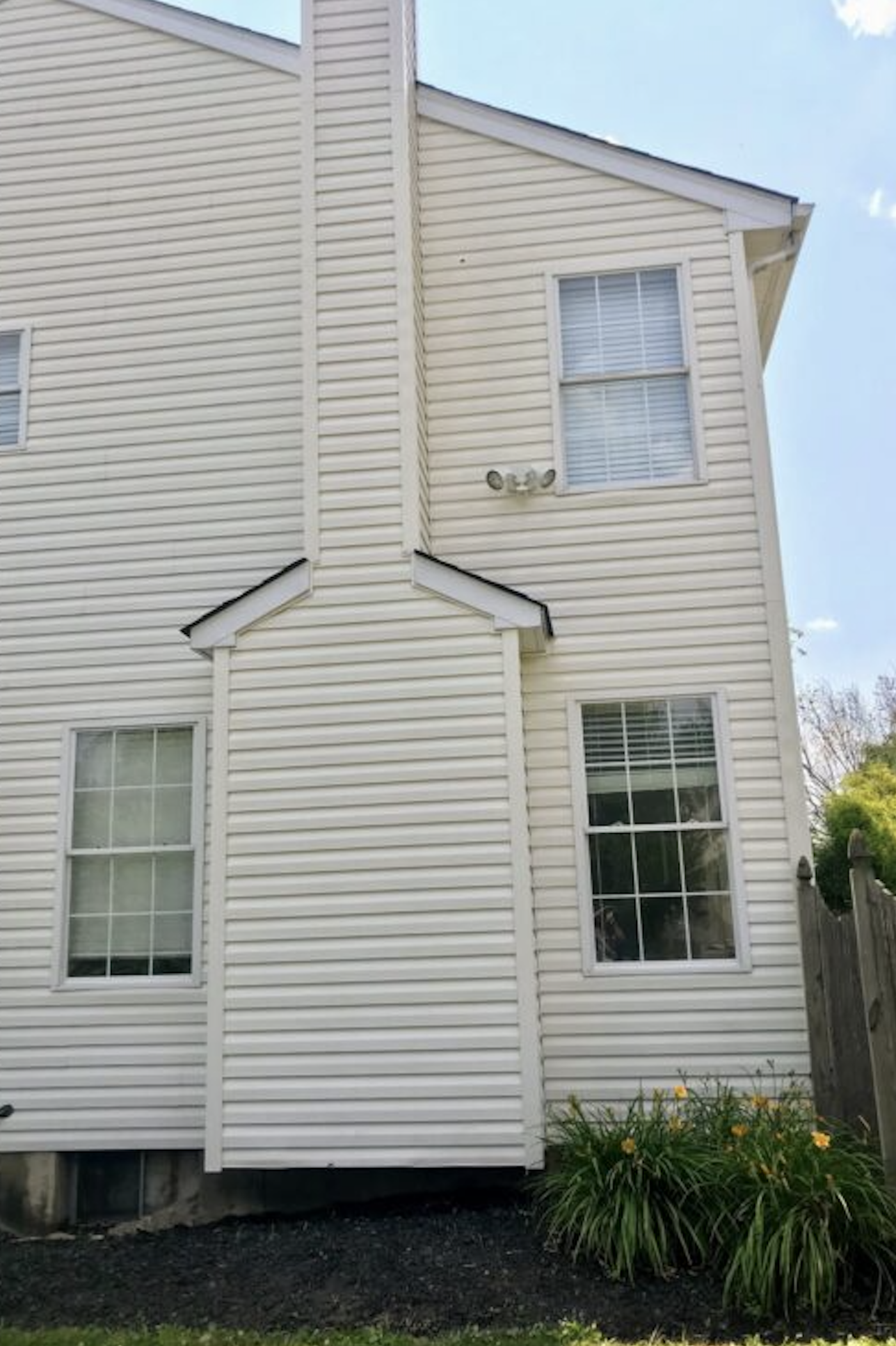 After: Two-story house before and after soft washing