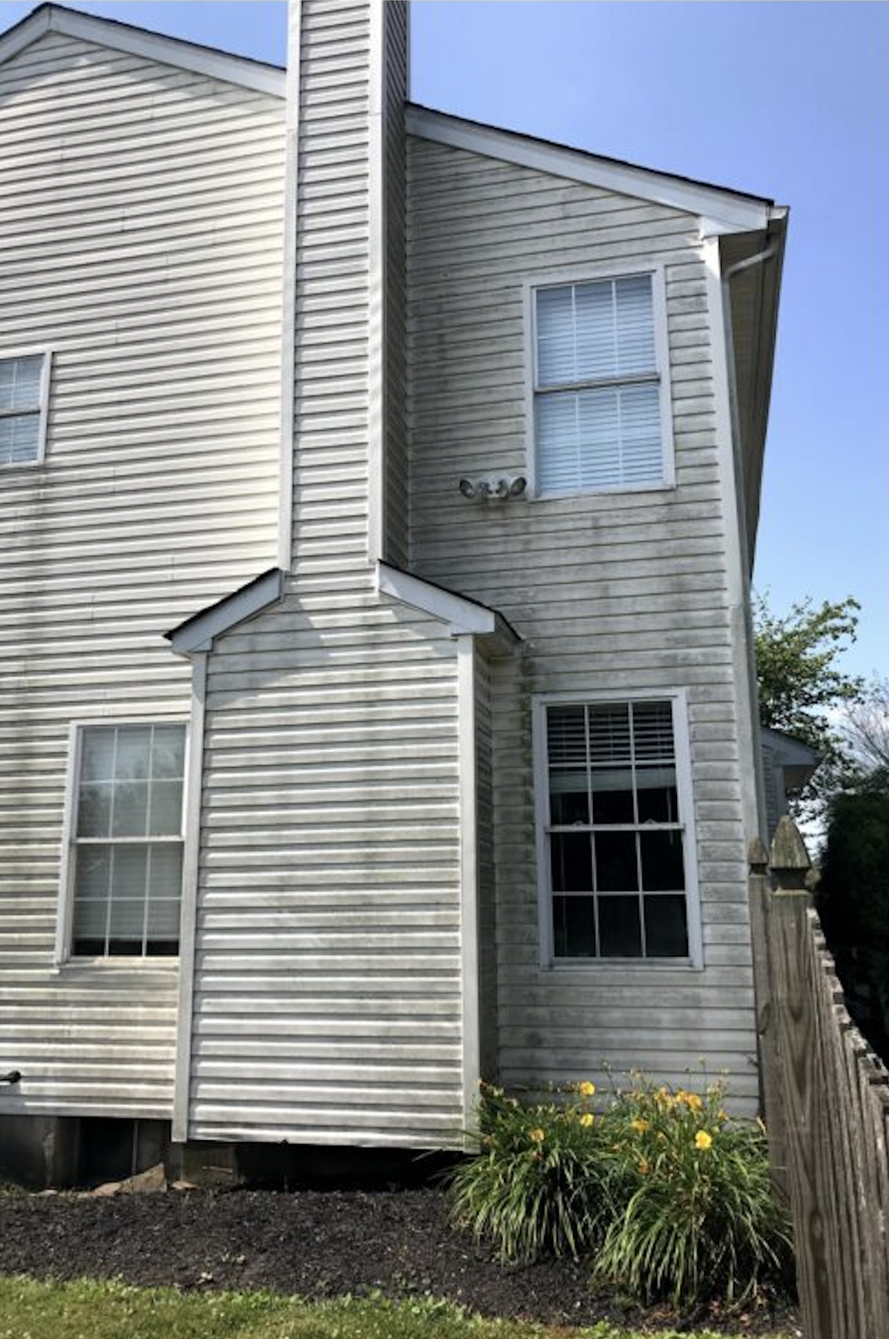 Before: Two-story house before and after soft washing